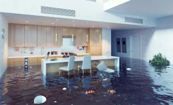 Modern kitchen with water damage caused by pipe leak and flooding
